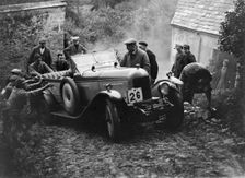 Morris or MG 14/28 of MH Fortlage receiving a push in the JCC Lynton Trial, 1932. Artist: Bill Brunell