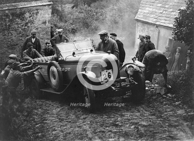Morris or MG 14/28 of MH Fortlage receiving a push in the JCC Lynton Trial, 1932. Artist: Bill Brunell.