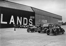 Morris, Ford V8 and MG PA Midget cars at the MCC Members Meeting, Brooklands, 10 September 1938. Artist: Bill Brunell