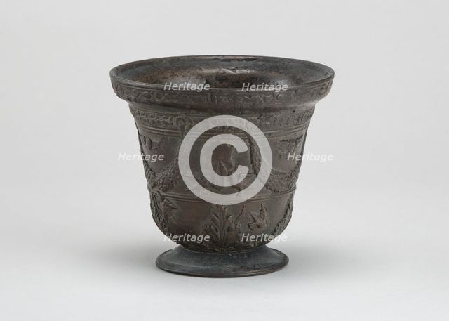 Mortar with Birds, Cherubim, Armorial Shield, and Festoons, early 16th century. Creator: Unknown.