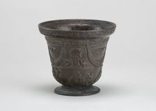 Mortar with Birds, Cherubim, Armorial Shield, and Festoons, early 16th century. Creator: Unknown