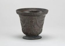 Mortar with Birds, Cherubim, Armorial Shield, and Festoons, early 16th century. Creator: Unknown