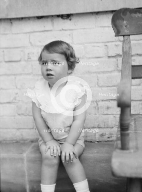 Moseley, F.S., Mr., child of, seated outdoors, 1930 May 24. Creator: Arnold Genthe.