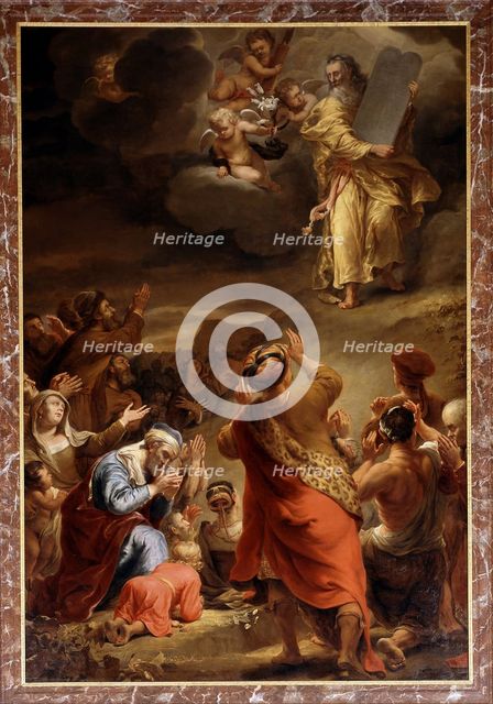 Moses descends from Mount Siniai with the Ten Commandments.