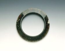 Moss-green agate pectoral ring, Warring States Period, China, 475-221 BC