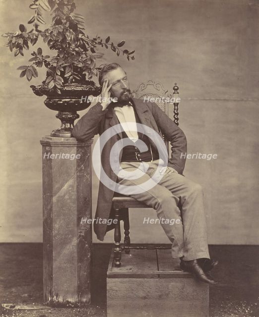 [Mathias Höusermann seated with elbow on pedestal holding a vase of flowers], 1850s-60s. Creator: Franz Antoine.