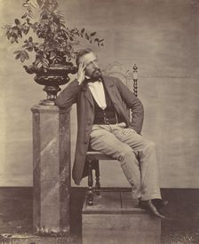 [Mathias Höusermann seated with elbow on pedestal holding a vase of flowers], 1850s-60s. Creator: Franz Antoine