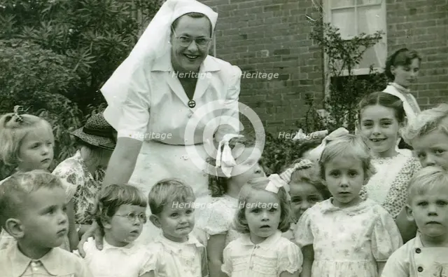 Matron Joan Gardner and children at St Monan's Hospital, 1952. Creator: Unknown.