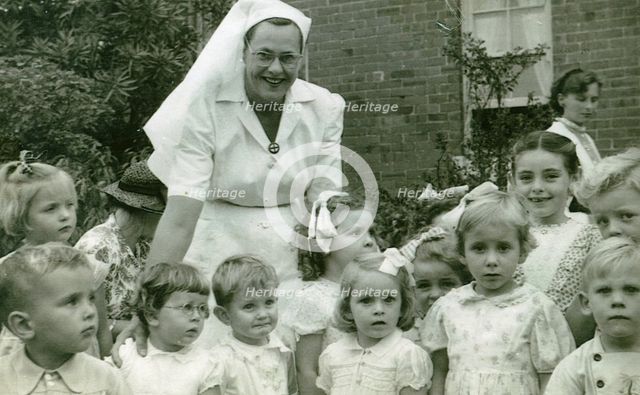 Matron Joan Gardner and children at St Monan's Hospital, 1952. Creator: Unknown.