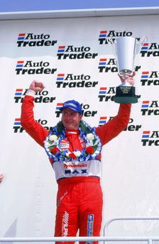 Matt Neal, Nissan driver, celebrates victory, 1999 British touring cars