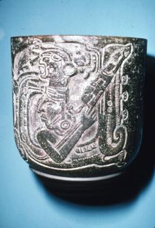 Mayan Pot of Man in high animal head-dress holding staff with lotus flower