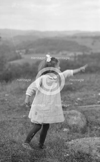 MacKaye, Percy, daughter of, standing outdoors, 1913 Sept. Creator: Arnold Genthe.