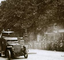 Machine gun mounted in armoured vehicle, victory parade, c1918