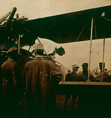 Machine gun mounted on a biplane, exhaust towards the top, c1914-c1918