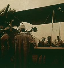Machine gun mounted on a biplane, exhaust towards the top, c1914-c1918