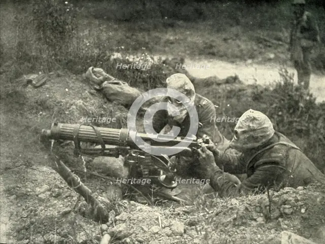 'Machine Gunners in Action Wearing their Gas Helmets', (1919).  Creator: Unknown.