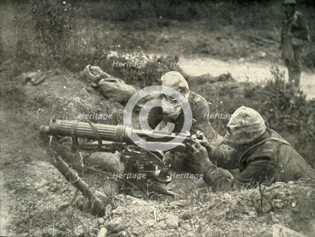 'Machine Gunners in Action Wearing their Gas Helmets', (1919).  Creator: Unknown.