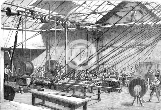 Machines covering with Gutta Percha the Atlantic Cable Wire, at the Gutta Percha Company's..., 1857. Creator: Unknown.