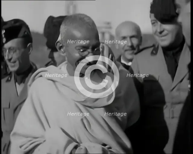 Mahatma Gandhi Standing with Others, 1930s. Creator: British Pathe Ltd.
