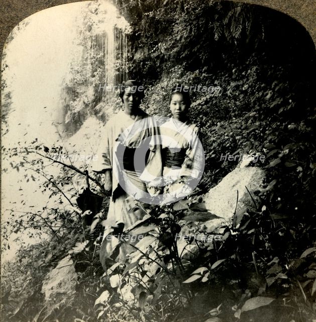 'Maidens of the Land of the Rising Sun, beneath the Kogijoku waterfalls...', c1900.  . Creator: Unknown.