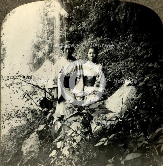 'Maidens of the Land of the Rising Sun, beneath the Kogijoku waterfalls...', c1900.  . Creator: Unknown.
