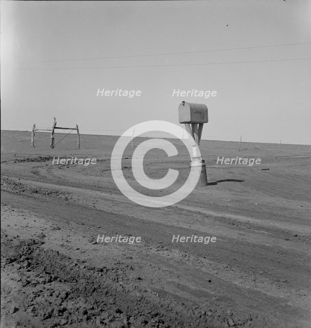 Mailbox in Dust Bowl, Coldwater District, north of Dalhart, Texas, 1938. Creator: Dorothea Lange.