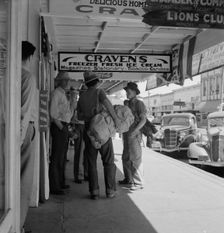 Main street, in front of Oregon Employment Center office, Independence, Polk County, Oregon, 1939. Creator: Dorothea Lange