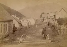 Main street in Petropavlovsk in Kamchatka. View of Mishennaya Sopka, 1890. Creator: Unknown