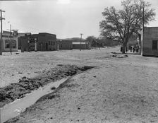 Main street of town showing irrigation ditch, Escalante, Utah, 1936. Creator: Dorothea Lange