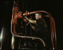 Maintenance man at the Combustion Engineering Co. working at the largest...Chattanooga, Tenn., 1942. Creator: Alfred T Palmer