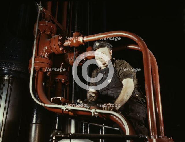 Maintenance mechanic in largest coal press..., Combustion Engineering Co., Chattanooga, Tenn., 1942. Creator: Alfred T Palmer.
