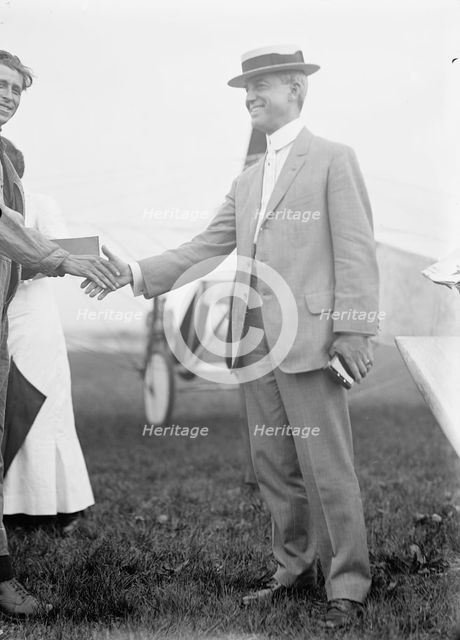 Maj. Edgar Russell, Signal Corps, U.S.A., Right, Shaking Hands with Aviator Wood, 1911. Creator: Harris & Ewing.