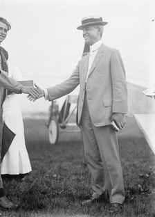 Maj. Edgar Russell, Signal Corps, U.S.A., Right, Shaking Hands with Aviator Wood, 1911. Creator: Harris & Ewing