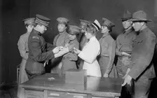 Major Connell inoculating woman motorist, 29 May 1917. Creator: Bain News Service