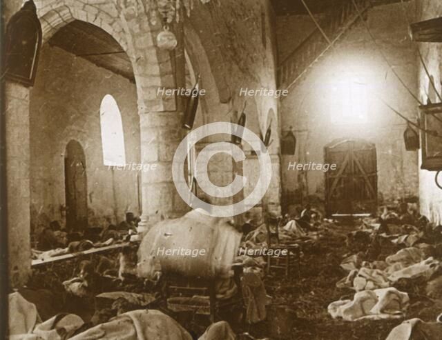 Makeshift hospital in a church, Marne, northern France, 1914. Artist: Unknown.