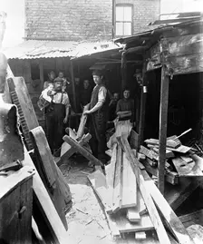 Making firewood from scrap timber, 1900s. Creator: John Galt
