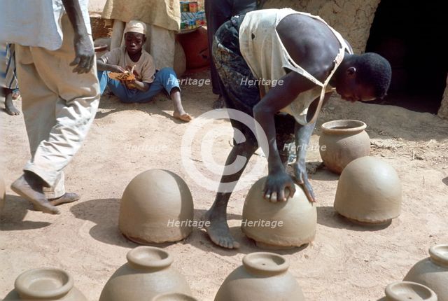 Making pots without a wheel, Nigeria, c1966. Creator: Unknown.