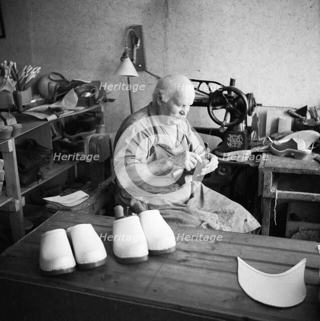 Making wooden clogs, Sweden. Artist: Unknown