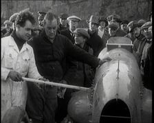 Malcolm Campbell Preparing his Car Bluebird Watched By a Crowd of Civilians, 1927. Creator: British Pathe Ltd