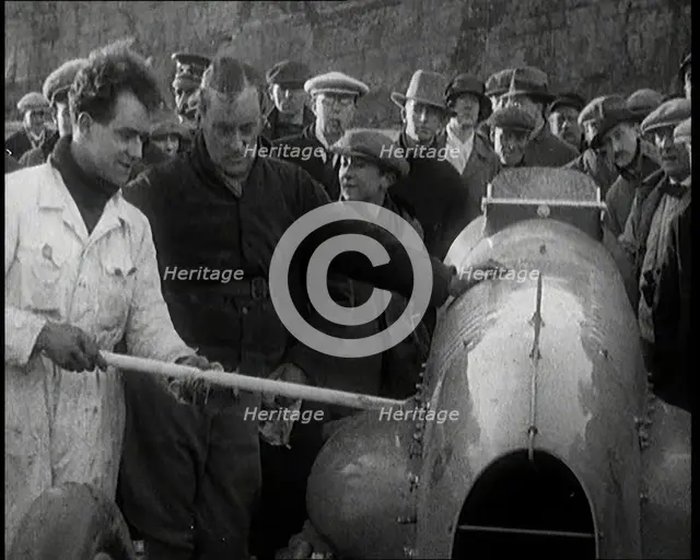 Malcolm Campbell Preparing his Car 'Bluebird' Watched By a Crowd of Civilians, 1927. Creator: British Pathe Ltd.