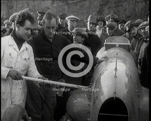Malcolm Campbell Preparing his Car 'Bluebird' Watched By a Crowd of Civilians, 1927. Creator: British Pathe Ltd.