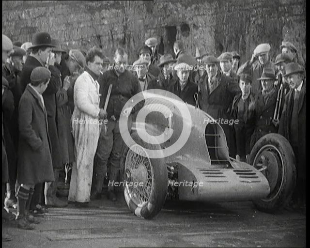 Malcolm Campbell Preparing his Car 'Bluebird' Watched By a Crowd of Civilians, 1927. Creator: British Pathe Ltd.