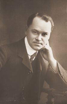 Malcolm Scott posing for a portrait, 1906. Creator: Unknown