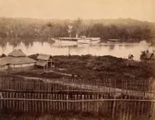 Malaya: steam yacht of the governor of the Straits Settlement on a Malaysian river, 1880. Creator: John Edmund Taylor