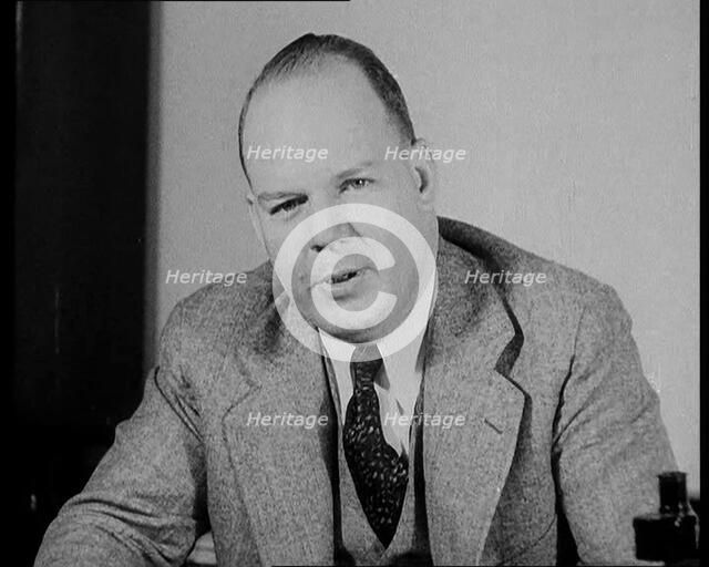 Male American Civilian Giving Expert Analysis in Court During the Lindbergh's Kidnapping Case...1930 Creator: British Pathe Ltd.