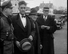 Male American Civilians Being Arrested by the Police, 1930. Creator: British Pathe Ltd