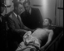 Male American Civilians Examining a Dead Body, 1930. Creator: British Pathe Ltd