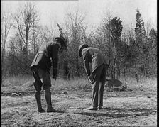 Male American Police Officers Investigating Footprints Outside American Aviator Charles..., 1930s. Creator: British Pathe Ltd