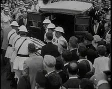 Male American Soldiers in White Uniforms Taking the Coffin of Anton Cermak, the Mayor of..., 1933. Creator: British Pathe Ltd