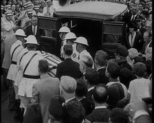 Male American Soldiers in White Uniforms Taking the Coffin of Anton Cermak, the Mayor of..., 1933. Creator: British Pathe Ltd